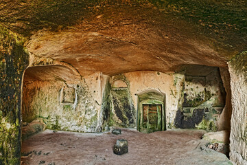 Matera, Basilicata, Italy: interior of an old cave house carved into the tufa rock in the old town...