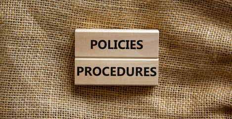 Policies and procedures symbol. Wooden blocks with concept words Policies procedures on canvas background. Business and policies and procedures concept. Copy space.