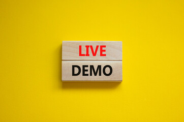 Live demo symbol. Concept words 'live demo' on wooden blocks on a beautiful yellow background. Copy space. Business and live demo concept. - obrazy, fototapety, plakaty