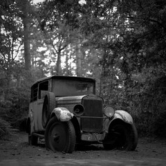 Abandoned oldtimer in the woods