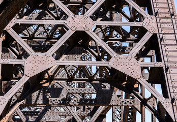 Bridge infrastructure with steel plates, girders and large bolts.