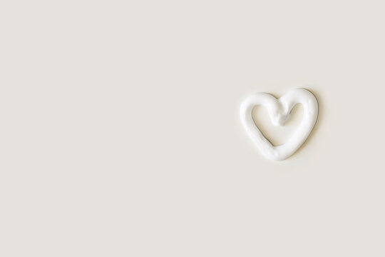 Heart Shape Cream. Beauty Lotion. Mayonnaise Smear On White Plate. Top View With Copyspace. White Product Smear. Valentine Concept