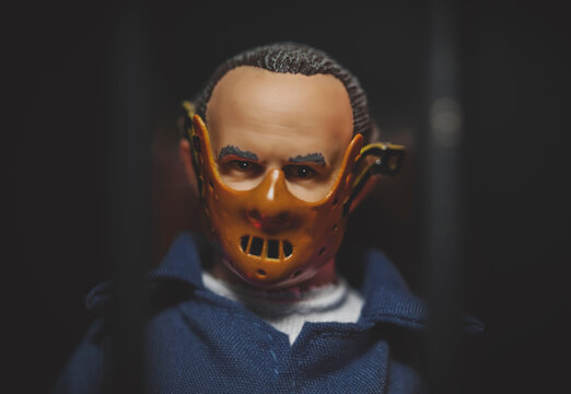 NEW YORK USA, JUNE 30 2021: recreation of a scene from Silence of the Lambs with Hannibal Lecter behind bars and wearing a mask - Mego Corporation action figure