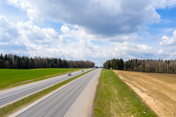 Aerial bird-eye view on freeway road in spring season