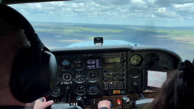 4k View from cockpit of a small propeller plane.