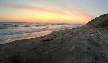 sunset next to a beach cliff in san diego