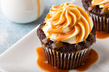 Chocolate cupcake with cream cheese frosting and caramel