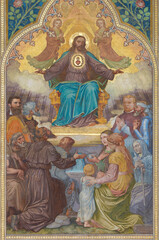 VIENNA, AUSTIRA - JUNI 24, 2021: The fresco of heart Jesus among the saints in the Votivkirche church by brothers Carl and Franz Jobst (sc. half of 19. cent.).