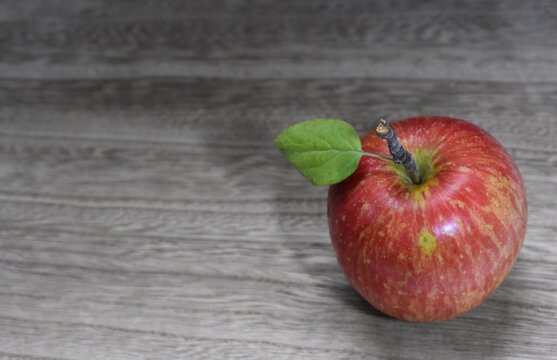 red apple on wooden background