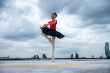 Fototapeta premium portrait of ballet dancer stretching motion education learning sport with elegance fun performance, flexibility gymnastics practicing balance art