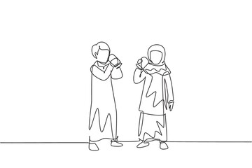 Single continuous line drawing pair of Arabian boys and girls standing while enjoying glass of fresh milk for growth and fulfillment of body nutrition. One line draw graphic design vector illustration