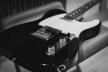 electric guitar waiting in the studio- black and white