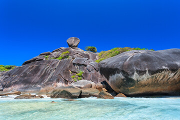 Beautiful sea with rock cliffs, On summer day, and clear sky, at Similan Island, one of the 10 most...