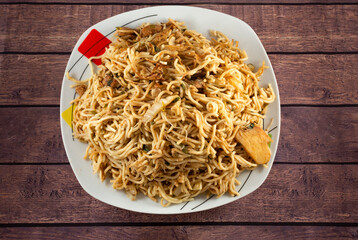 Tallarin chaufa saltado with chicken, holantao, Chinese onion, and oriental vegetables.