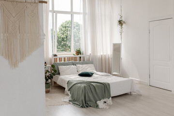Ficus bed. Home interior. Scandinavian style . Bed with ficus. Home interior. Scandinavian style