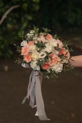 Wedding bouquet of the bride in delicate shades