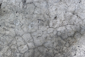 Dark gray stone background. Texture with scratches and cracks.