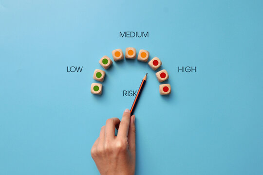 Wooden Cubes In The Form Of A Speedometer Showing The Riskiness In Business. High Risk Of Business Collapse