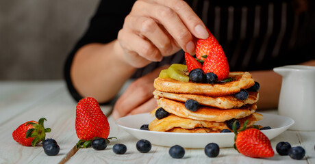 Woman preparing pancakes