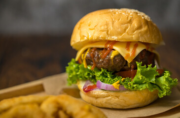 Close up shot of ready to eat homemade beef hamburger with fresh vegetables
