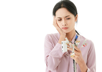 Isolated cut out shot of Asian businesswoman worker employee with confuse face getting  problem and trouble with variety types of cable line wire computer internet technology connection in office