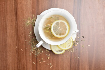 hot ginger lemon fruit tea bag drink in beautiful England design white cup hot healthy beverage menu