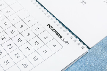 Flip paper calendar on color background, closeup