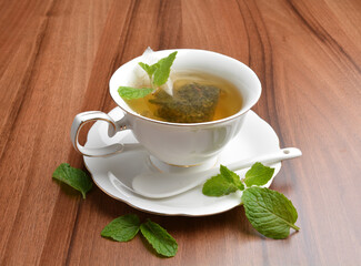hot moroccan mint leaf tea bag drink in beautiful England design white cup hot healthy beverage menu