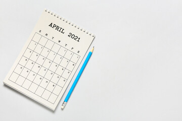 Flip paper calendar and pencil on light background