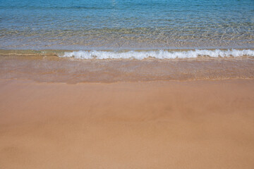 Fototapeta na wymiar Beach and tropical sea and golden sand. Nature ocean landscape background.