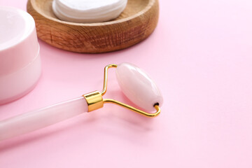 Facial massage tool on color background, closeup