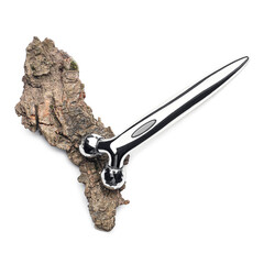 Obraz premium Facial massage tool and tree bark on white background