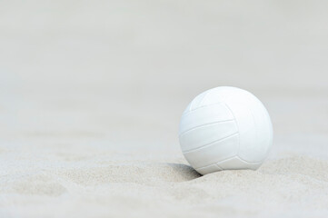 Beach volleyball ball on the sand beach. Team sport concept