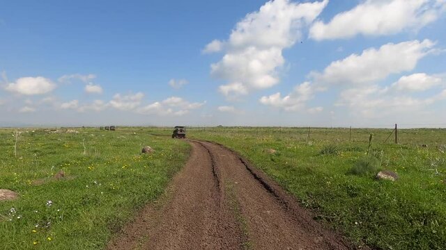 Driving nature road, landscape and scenic environment. Driver Point of view. Riding sports utility vehicle UTV side by side 4x4 4 wheel drive ATV.
