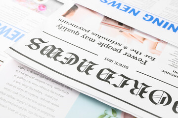 Different newspapers as background, closeup