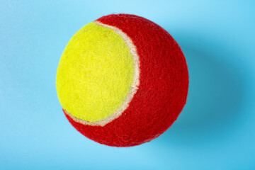 tennis ball on a blue background close up