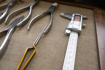 Professional repair tool and fixing damaged glasses in clinic office. Eyewear concept.