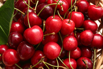 Basket with tasty ripe cherry, closeup