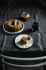 Poppy seed bundt cake served with salted caramel and black coffee