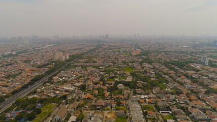 Aerial cityscape modern city Surabaya with skyscrapers, buildings and houses. city skyline with skyscrapers and business centers Surabaya capital city east java, indonesia