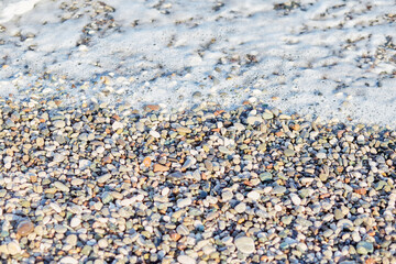 View of the Mediterranean sea and pebbles texture. Summer wallpaper or print. Seamless pattern
