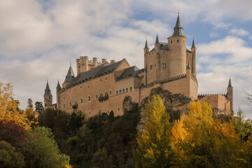 Fototapeta na wymiar Castle of Segovia, Spain, in autumn with cloudy sky
