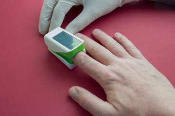 the process of measuring blood oxygen saturation using a pulse oximeter. finger pulse oximeter
