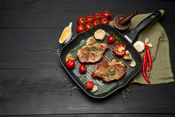 Grilled roated beef steaks on frying pan