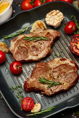 Grilled roated beef steaks on frying pan