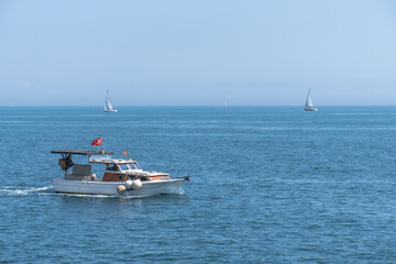 Fototapeta na wymiar small fishing boat in the sea, yacht, sailboats,