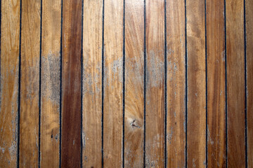 Old rusty texture on brown wooden painted cracked door close up