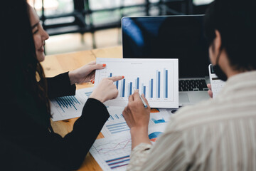 Close up asian business adviser meeting to analyze and discuss the situation on the financial report in the meeting room.Investment Consultant, Financial advisor and accounting concept.