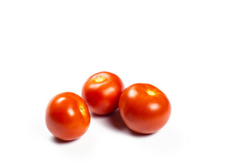 Tomatoes. Three red tomatoes on a white background.