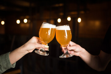 beer glasses in hands